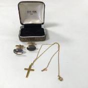 A 9ct gold crucifix on chain (22cm) (1.89g) and a pair of oval shaped sleevelinks with mother of
