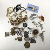 A collection of costume jewellery including paste and glass bead necklaces, earrings, brooches,