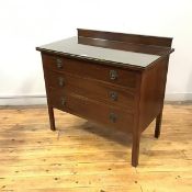 An Edwardian mahogany chest, with raised gallery and rectangular top above three drawers, raised