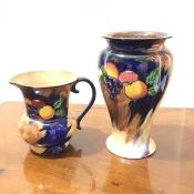 An H & K Tunstall baluster shaped vase in Autumn pattern (h.22cm x d. 14cm), with a jug of the