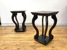 A pair of modern ebonised plant stands/occasional tables, each projecting square top with moulded
