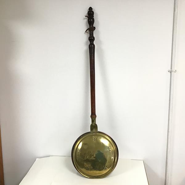 A 19thc treen handled brass bed warming pan with pierced and engraved hinged top