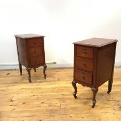 A pair of early 20thc French painted wooden bedside cabinets, each with rectangular top with moulded