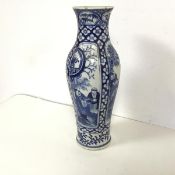 An early 20thc blue and white Chinese baluster shaped vase with four panels depicting figures