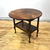 A 1930s mahogany occasional table, the circular top with twin drop flaps and quarter veneers above