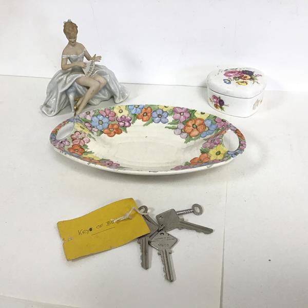 A mixed lot including a German figurine with floral border, a heart shaped dish and a collection