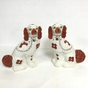 A pair of Staffordshire chimney spaniels with gilt collar and lead with Arthur Wood back stamp (h.