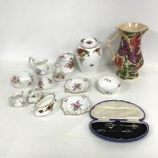 A collection of 1930s Royal Crown Derby including a sugar bowl, milk jug, salt and pepper shaker,