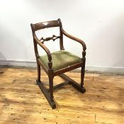 A Scottish Regency mahogany elbow chair, the fielded tablet top rail and pierced mid rail within