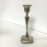 A weighted Birmingham silver candlestick, 1942, with an urn shaped candleholder on tapering stem and