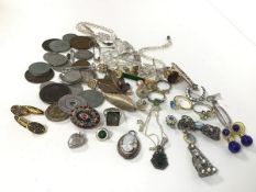 A collection of costume jewellery including necklaces, earrings, brooches, rings etc., with a mother