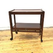 An early 20thc mahogany hostess trolley of two rectangular tiers with adjustable mechanism, raised