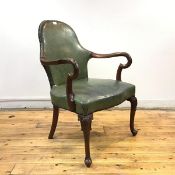 A George II style library armchair, c.1900, the arched back and padded seat upholstered in green