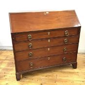 A late George III mahogany bureau, c.1800, the rectangular fall front enclosing a fitted satinwood