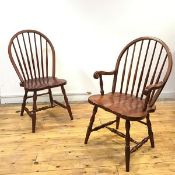 A set of ten cherrywood stick back chairs, to include a pair of armchairs, each hoop shaped back