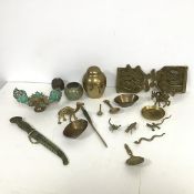 An assortment of brass items including a scorpion, a lizard, a camel, a Man Riding a Donkey, a