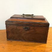 A George III mahogany tea caddy, the rectangular hinged top opens to reveal two tea cannisters,