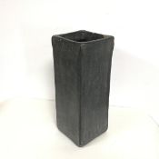 A black glazed stoneware square vase (h.39cm x 14cm x 15cm) (some losses to glazing)