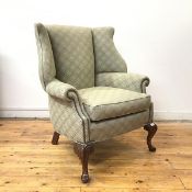 A George II style lug armchair, first half of the 20thc., the back, arms and seat with close