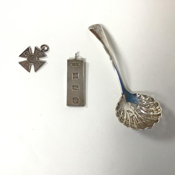 A Birmingham silver ingot for use as a pendant, a Birmingham silver cross with the letters CLBDL,