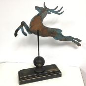 A New England style copper plate weather vane in the form of a Leaping Stag, with some verdigris