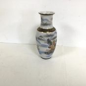 A Japanese glass vase of baluster form with gilt and painted decoration depicting pagodas and a