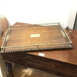 An Edwardian oak tea tray with Epns mounted bobbin turned handles, gallery and with a beaded edge,