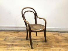 A child's bentwood armchair by Thonet the hoop shaped back and circular seat on turned legs, bears