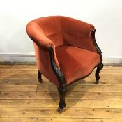 A late 19thc mahogany tub chair, the hoop shaped back and padded seat upholstered in orange velvet