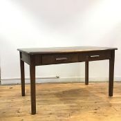 An early 20thc stained oak desk, the rectangular top with rounded corners above two frieze