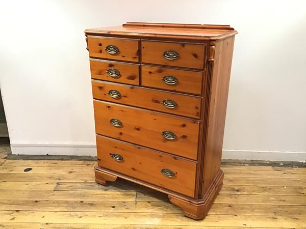 A modern pine and ebonised chest, possibly American, the rectangular top with shallow gallery and