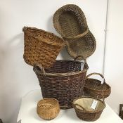 An assortment of wicker baskets including flower baskets and laundry basket (largest: 40cm x d.