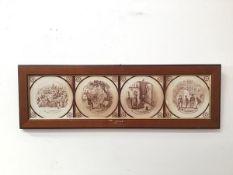 Four Victorian transfer printed tiles depicting Dickensian scenes, mounted in a moulded wooden frame