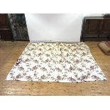 A modern pair of cotton fabric curtains, the pale coloured field printed with Indian figures and