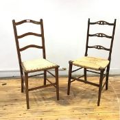 A small country ladder back chair, each spar with quatrefoil detail above a quarter woven seat,