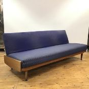 A 1950s teak framed sofa bed, the padded back and seat upholstered in blue hounds tooth tweed