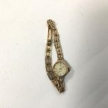 An Everite lady's wristwatch with a 9ct gold strap (8cm) (8.42g)