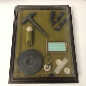 Golf interest: a wall hanging display case, with items of golf interest, displaying how a feathery