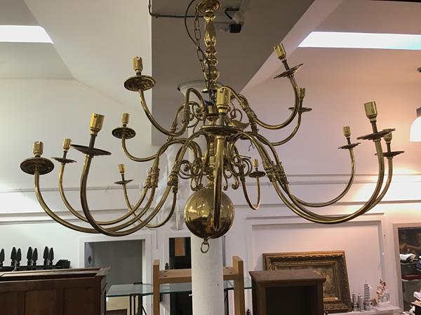 A modern brass ceiling pendant in the 17thc Dutch style, the turned shaft radiating fifteen