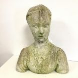 A cement bust of a Young Lady with visible details to her blouse and a pendant, possibly carved