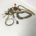 A collection of chains and chain fragments, bangles and necklaces including a multiple chain