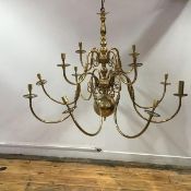 A modern brass chandelier in the 17thc Dutch style, the baluster turned shaft with twelve