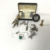 A mixed lot comprising a grouse claw brooch with a silver thistle mount with citrine, a silver chain