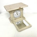 A mid 20thc shop scale, painted white, with a hinged mirror which drops to reveal and upside dial