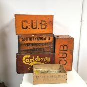 A collection of beer crates including Cub, Carlsberg, Scottish & Newcastle Breweries and a Stork