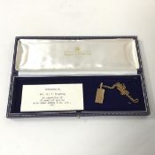 A 9ct gold ingot on chain (15.15g), presented to Mrs Browning after 30 years working at James Walker