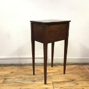 A late George III mahogany and ebony strung work table, the hinged rectangular top enclosing an open