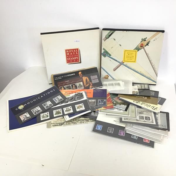 A collection of stamps: UK mint loose presentation packs, year packs etc. face value c.£120