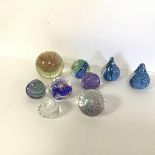 A collection of Caithness glass paperweights including Reflections, Weaver, Pebbles, Raindrops (8)