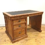 A 19thc style pedestal desk, the rectangular top with inset writing surface above a pair of pull out
